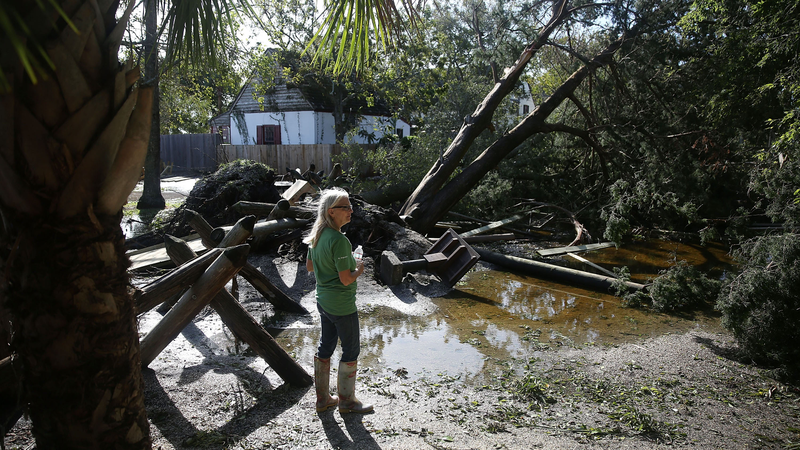 Cindy Stayvely looks at some of the damage in the Colonial Quarter after Hurricane Matthew passed through the area on October 8, 2016 in St Augustine, Florida. Across the Southeast, cver 1.4 million people have lost power due to Hurricane Matthew which has been downgraded to a category 1 hurricane on Saturday morning. (Image: Getty)